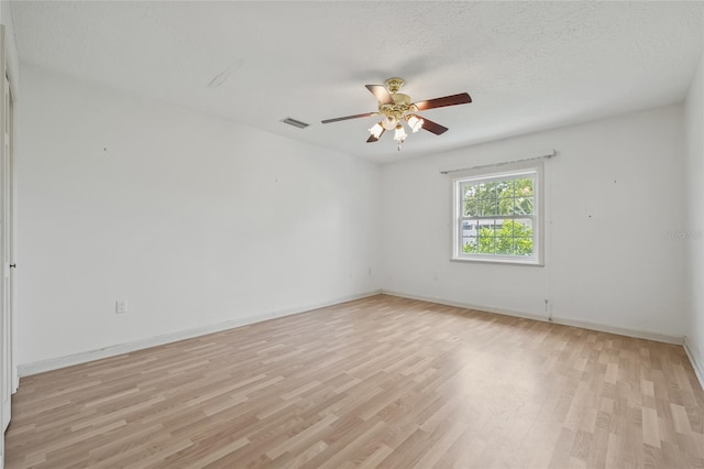 6103 6th Ave NW, Bradenton, FL 34209 - unfurnished room with light wood-style flooring, a ceiling fan, and a textured ceiling