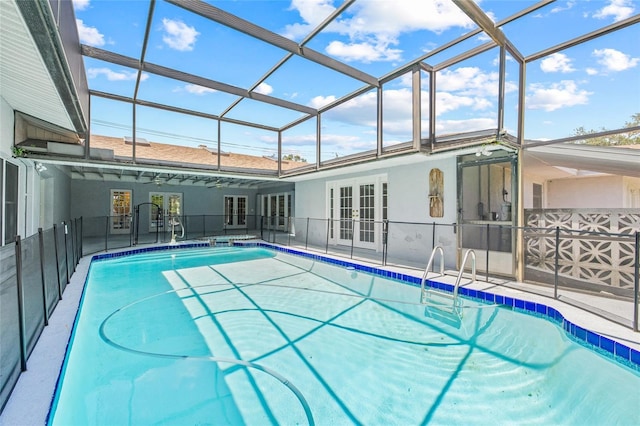 6103 6th Ave NW, Bradenton, FL 34209 - swimming pool with french doors, glass enclosure, and a patio area