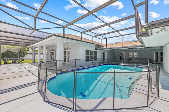 6103 6th Ave NW, Bradenton, FL 34209 - swimming pool with french doors, a patio area, glass enclosure, and ceiling fan