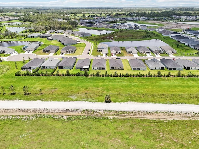 6528 166th Pl E, Parrish, FL 34219 - aerial perspective of suburban area with a nearby body of water