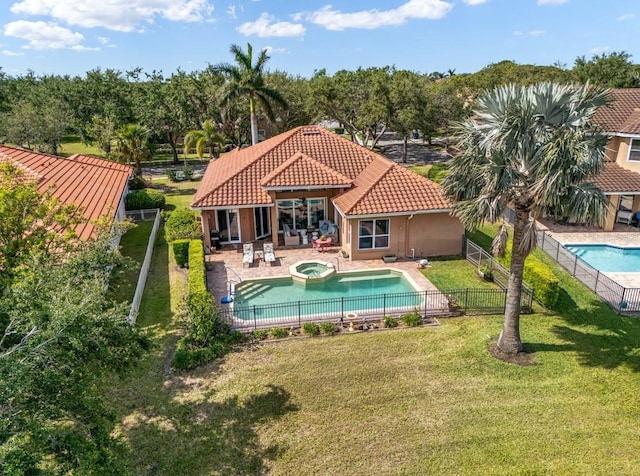 7521 Aralia Way, Seminole, FL 33777 - view of pool featuring an in-ground hot tub, a fenced backyard, and a patio area
