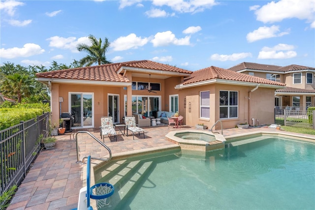 7521 Aralia Way, Seminole, FL 33777 - back of property with an outdoor living space, a fenced backyard, a patio area, a tile roof, and stucco siding