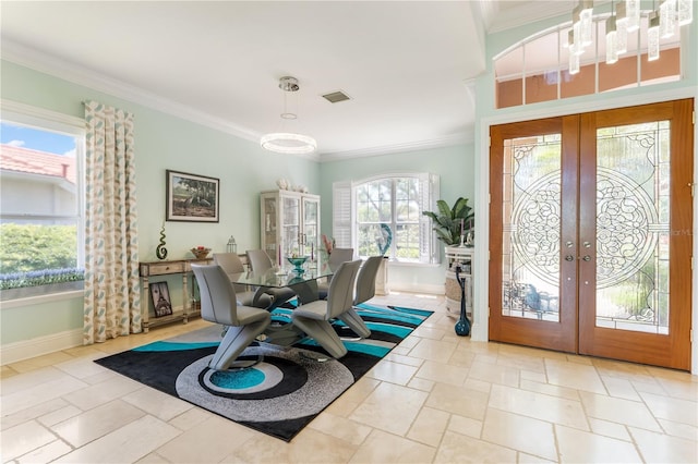 7521 Aralia Way, Seminole, FL 33777 - foyer entrance with french doors, crown molding, a chandelier, and stone tile flooring