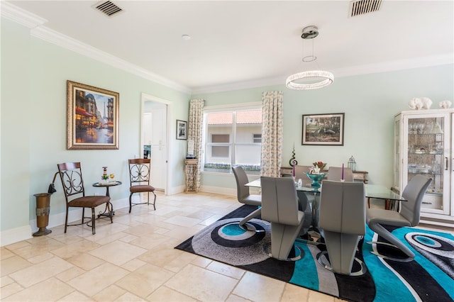 7521 Aralia Way, Seminole, FL 33777 - dining area featuring ornamental molding and stone tile flooring