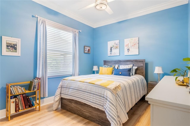 7521 Aralia Way, Seminole, FL 33777 - bedroom with light wood-style floors, ornamental molding, and a ceiling fan