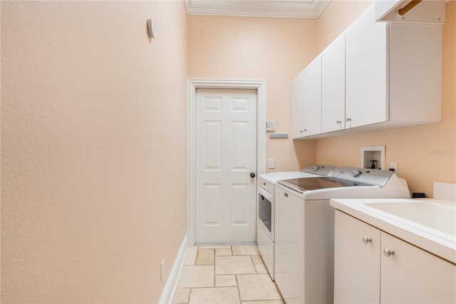 7521 Aralia Way, Seminole, FL 33777 - washroom featuring washing machine and dryer, cabinet space, ornamental molding, and light stone finish flooring