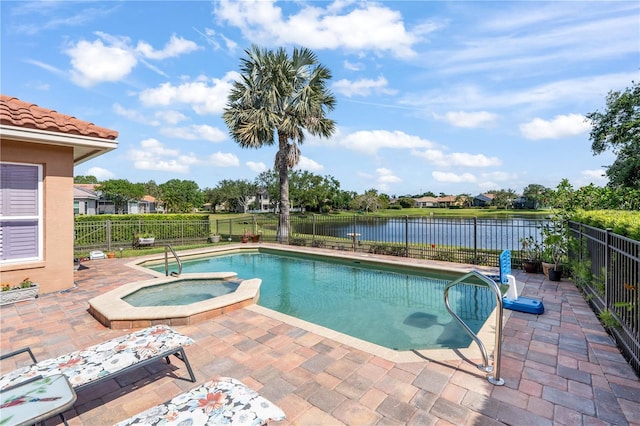 7521 Aralia Way, Seminole, FL 33777 - view of swimming pool with a patio, a water view, a fenced backyard, and a pool with connected hot tub