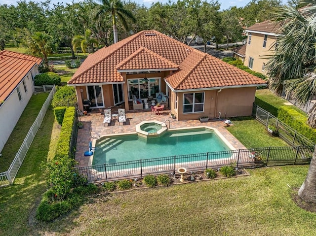 7521 Aralia Way, Seminole, FL 33777 - rear view of property featuring a tiled roof, stucco siding, a fenced backyard, a patio area, and a pool with connected hot tub