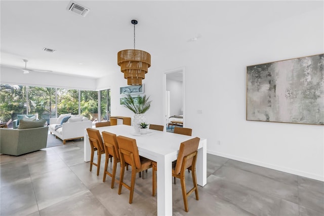 2065 Goldenrod St, Sarasota, FL 34239 - dining area featuring a chandelier and baseboards