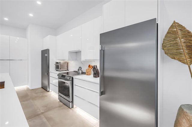 2065 Goldenrod St, Sarasota, FL 34239 - kitchen featuring stainless steel appliances, modern cabinets, white cabinetry, light countertops, and recessed lighting