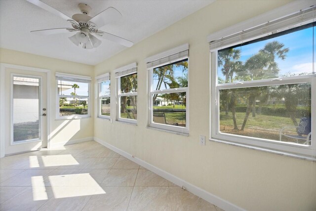 107 Clipper Way Unit 107, Nokomis, FL 34275 - unfurnished sunroom featuring healthy amount of natural light and tile patterned flooring