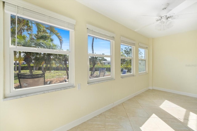107 Clipper Way Unit 107, Nokomis, FL 34275 - unfurnished sunroom featuring baseboards and tile patterned flooring