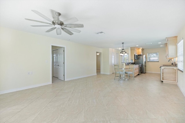 107 Clipper Way Unit 107, Nokomis, FL 34275 - living room featuring a ceiling fan and baseboards