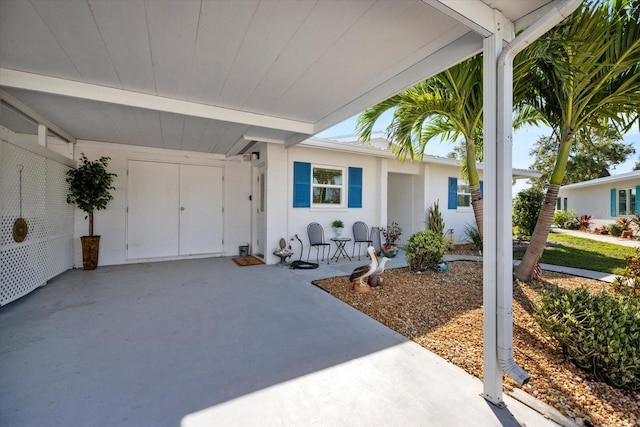 107 Clipper Way Unit 107, Nokomis, FL 34275 - view of patio featuring an attached carport