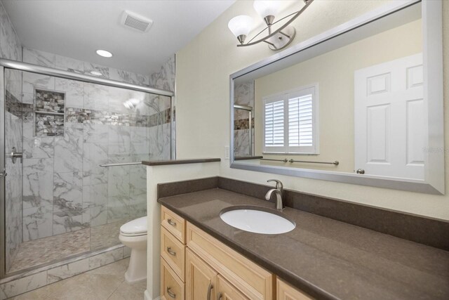 107 Clipper Way Unit 107, Nokomis, FL 34275 - bathroom featuring vanity, a marble finish shower, and tile patterned floors