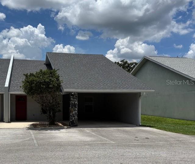 888 W Stuart St, Bartow, FL 33830 - view of front of home featuring driveway, a garage, and roof with shingles