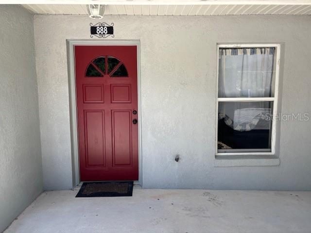 888 W Stuart St, Bartow, FL 33830 - entrance to property featuring stucco siding