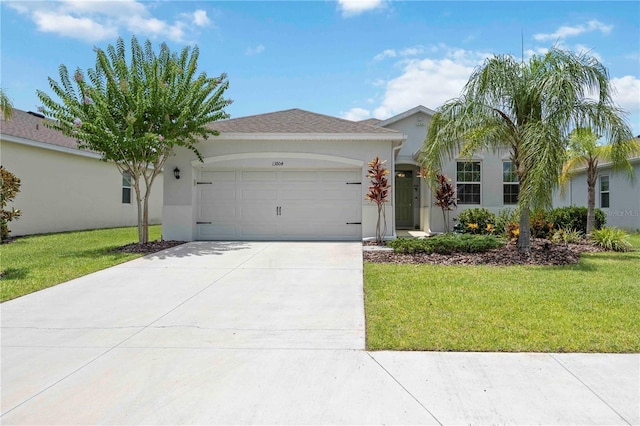 13804 Woodbridge Ter, Lakewood Ranch, FL 34211 - ranch-style home featuring stucco siding, an attached garage, and a front lawn