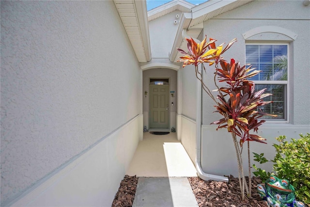 13804 Woodbridge Ter, Lakewood Ranch, FL 34211 - view of exterior entry featuring stucco siding