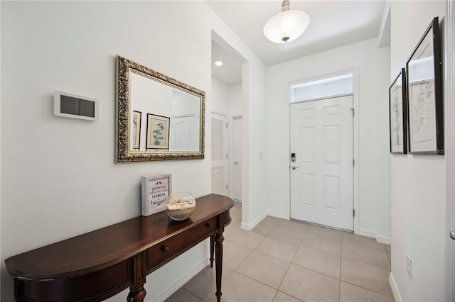 13804 Woodbridge Ter, Lakewood Ranch, FL 34211 - foyer entrance with baseboards and light tile patterned floors