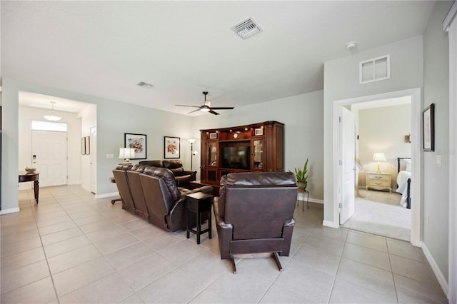 13804 Woodbridge Ter, Lakewood Ranch, FL 34211 - living area featuring light tile patterned floors and a ceiling fan