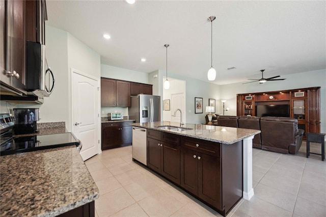 13804 Woodbridge Ter, Lakewood Ranch, FL 34211 - kitchen with appliances with stainless steel finishes, light tile patterned floors, dark brown cabinetry, ceiling fan, and recessed lighting