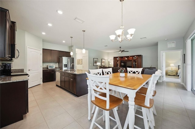 13804 Woodbridge Ter, Lakewood Ranch, FL 34211 - dining room featuring a chandelier, light tile patterned flooring, and recessed lighting