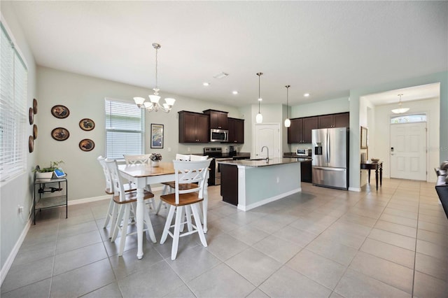 13804 Woodbridge Ter, Lakewood Ranch, FL 34211 - dining space featuring a chandelier, light tile patterned flooring, and recessed lighting