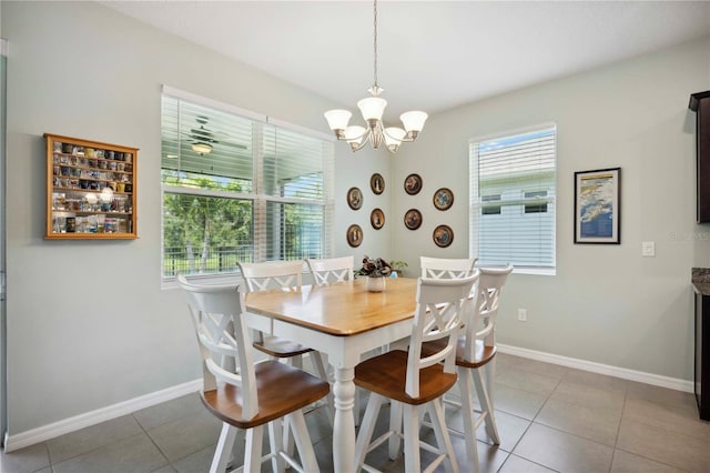 13804 Woodbridge Ter, Lakewood Ranch, FL 34211 - dining space with a chandelier and tile patterned floors