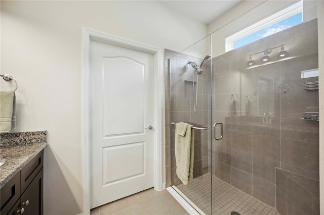 13804 Woodbridge Ter, Lakewood Ranch, FL 34211 - bathroom featuring vanity, a stall shower, and tile patterned floors