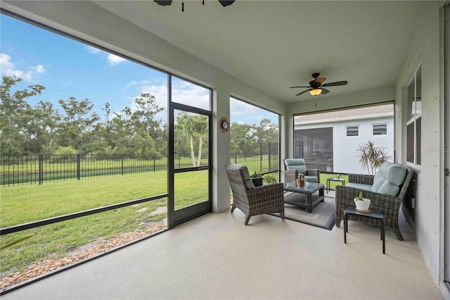 13804 Woodbridge Ter, Lakewood Ranch, FL 34211 - sunroom featuring ceiling fan, outdoor lounge area, and view of scattered trees