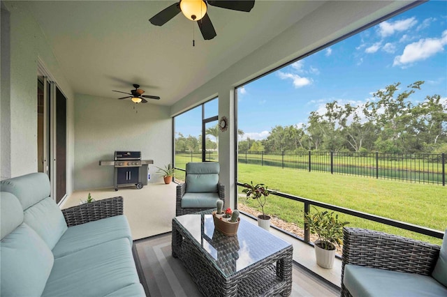 13804 Woodbridge Ter, Lakewood Ranch, FL 34211 - sunroom / solarium featuring ceiling fan, an outdoor hangout area, and view of wooded area