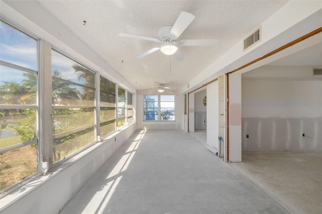564 Spanish Dr N, Longboat Key, FL 34228 - unfurnished sunroom featuring a ceiling fan