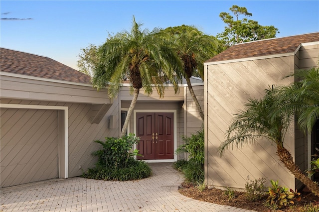 3658 Torrey Pines Way, Sarasota, FL 34238 - doorway to property with roof with shingles