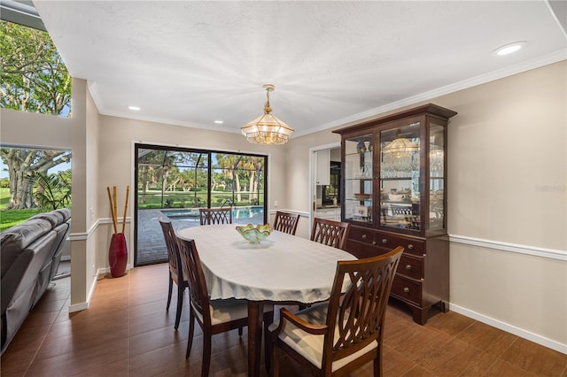 3658 Torrey Pines Way, Sarasota, FL 34238 - dining room with a chandelier, wood finished floors, recessed lighting, and crown molding