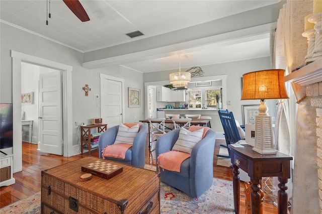 403 29th St NW, Bradenton, FL 34205 - living area with wood-type flooring, ceiling fan, and ornamental molding
