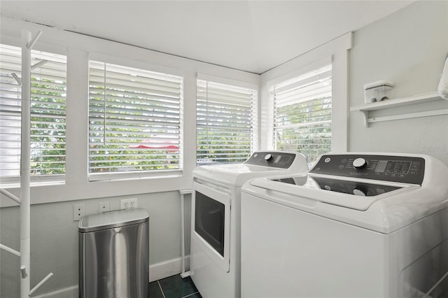 403 29th St NW, Bradenton, FL 34205 - washroom with independent washer and dryer and dark tile patterned flooring
