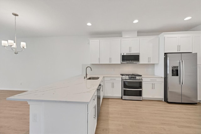 17823 Cherished Loop, Bradenton, FL 34211 - kitchen featuring appliances with stainless steel finishes, white cabinetry, tasteful backsplash, and recessed lighting