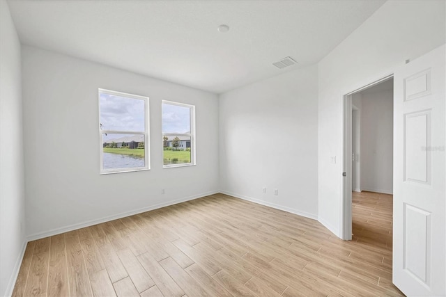 17823 Cherished Loop, Bradenton, FL 34211 - unfurnished room featuring light wood finished floors