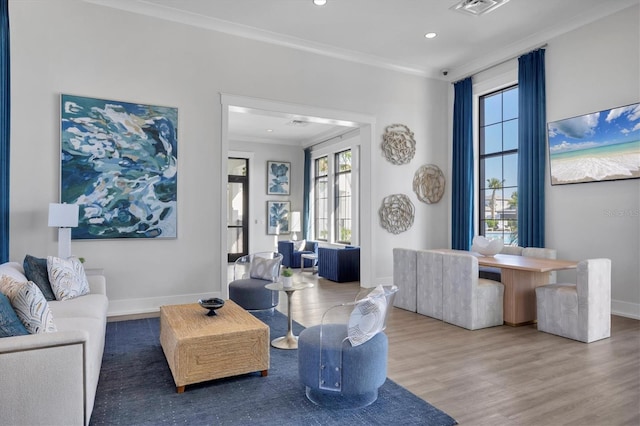 17823 Cherished Loop, Bradenton, FL 34211 - living area featuring ornamental molding, healthy amount of natural light, wood finished floors, and recessed lighting