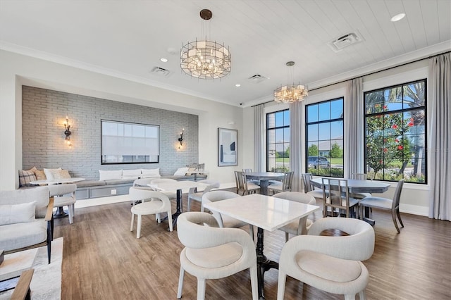 17823 Cherished Loop, Bradenton, FL 34211 - dining area with a chandelier, wood finished floors, recessed lighting, and crown molding