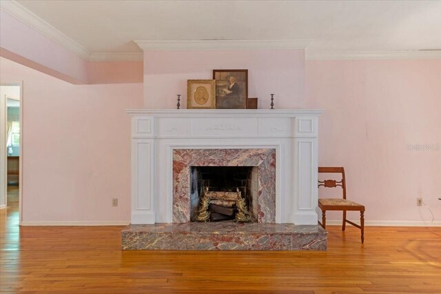 1541 Flower Dr, Sarasota, FL 34239 - detailed view of wood finished floors, crown molding, and a high end fireplace
