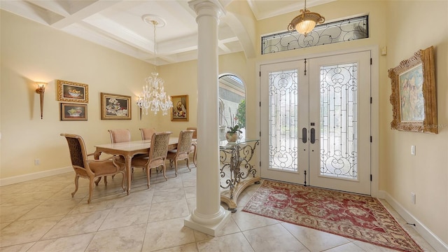 8832 Enclave Ct, Sarasota, FL 34238 - entryway featuring decorative columns, french doors, light tile patterned flooring, ornamental molding, and coffered ceiling