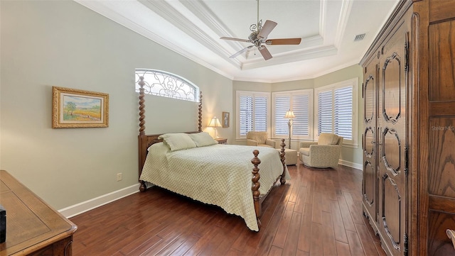 8832 Enclave Ct, Sarasota, FL 34238 - bedroom with a raised ceiling, multiple windows, crown molding, and dark wood-style flooring