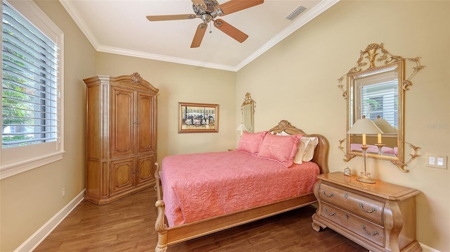 8832 Enclave Ct, Sarasota, FL 34238 - bedroom with wood finished floors, ornamental molding, and a ceiling fan