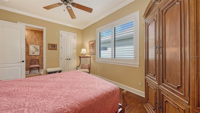 8832 Enclave Ct, Sarasota, FL 34238 - bedroom with ornamental molding, dark wood finished floors, a ceiling fan, and a closet