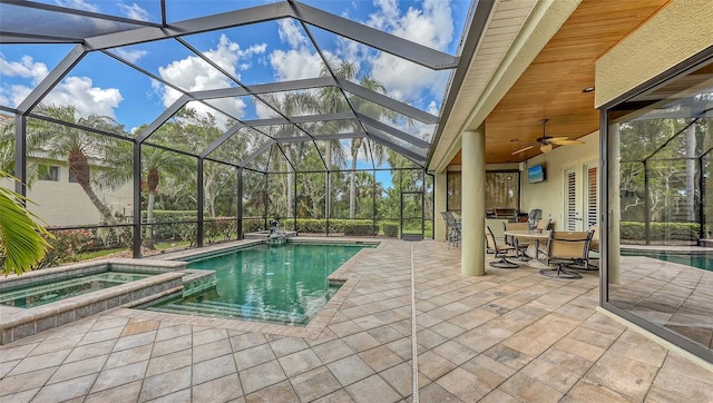 8832 Enclave Ct, Sarasota, FL 34238 - view of pool featuring a patio area, glass enclosure, a pool with connected hot tub, and a ceiling fan