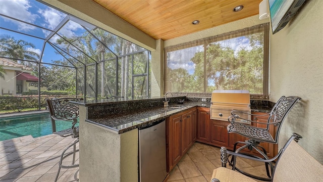 8832 Enclave Ct, Sarasota, FL 34238 - view of patio / terrace with exterior kitchen, glass enclosure, and an outdoor pool