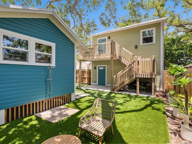 1732 6th St, Sarasota, FL 34236 - back of property featuring stairway and a wooden deck