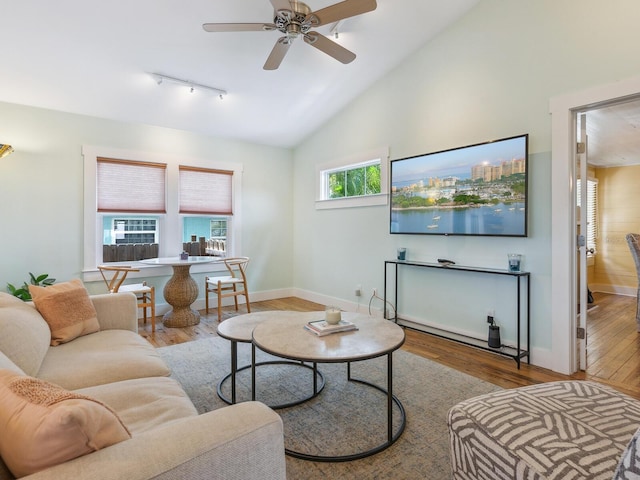 1732 6th St, Sarasota, FL 34236 - living room with a ceiling fan, wood finished floors, rail lighting, and vaulted ceiling
